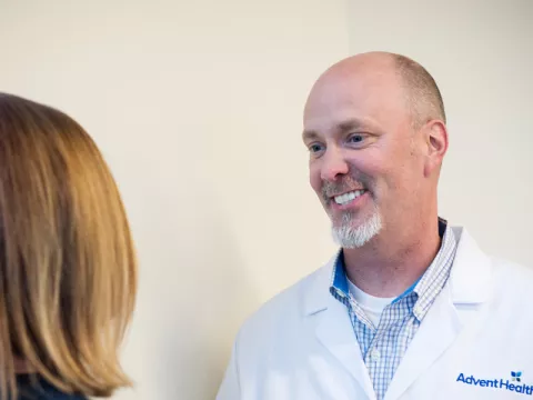 Dr. Eric Turner visiting with a patient