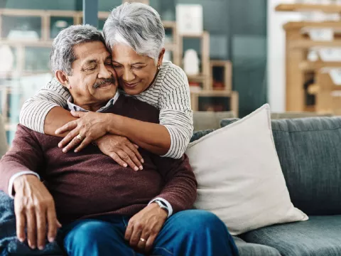 A mature wife hugging her husband