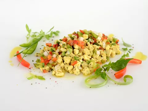 scrambled tofu mixed with bell peppers and onions