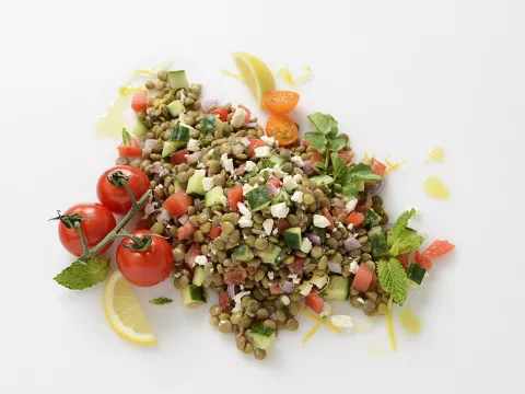 Garden lentil salad with tomato garnishes