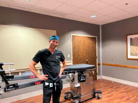 Orthopedic Surgeon Safa Fassihi, MD, stands next to new Hana Table.