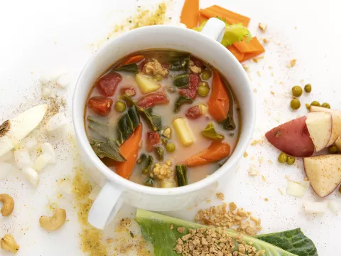 Bowl of Hungarian stew with potato garnish