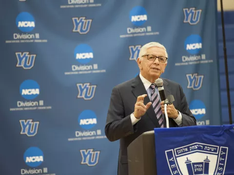 Ex-NBA Commissioner David Stern presents at a high school