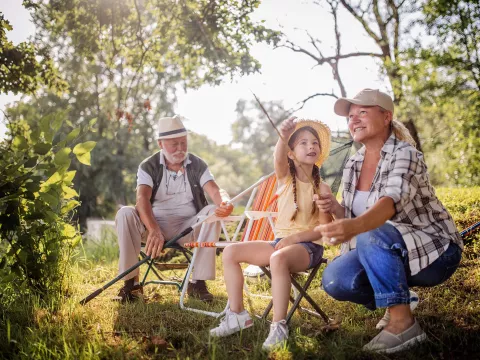 Grandparents getting ready to fish with their granddaughter