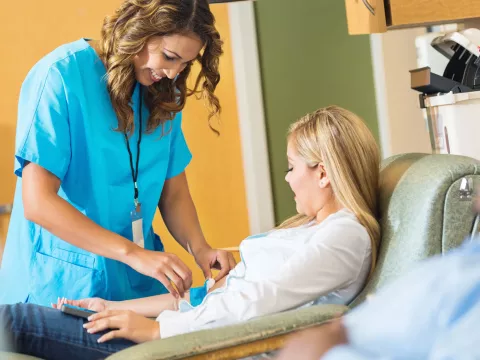 A patient gets her blood drawn.