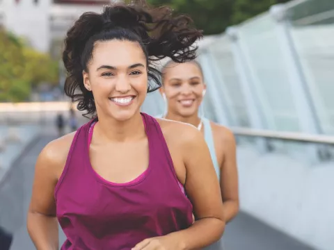 Two women running.