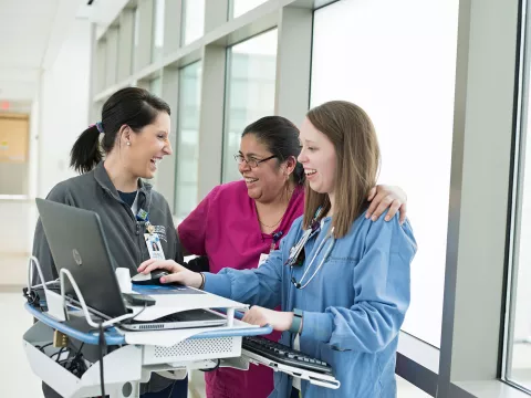 Group of nurses happily working together.