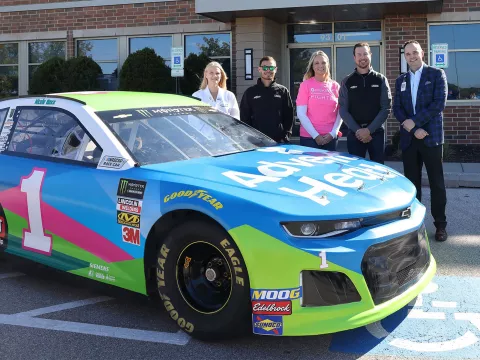 AdventHealth employees alongside Nascar representatives