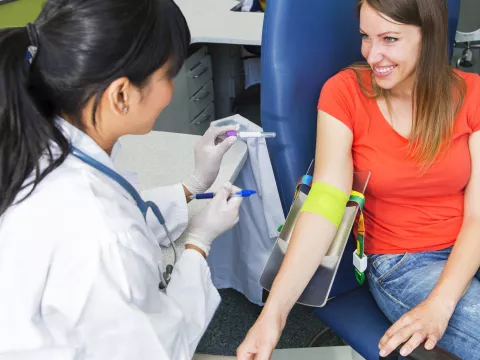 Woman preparing to have her blood drawn