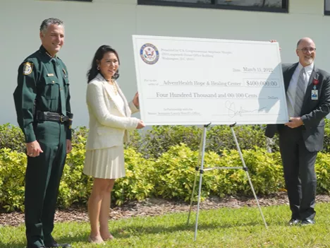 Sheriff Dennis Lemma, Rep. Stephanie Murphy and Tim Cook at Hope and Healing Center in Sanford