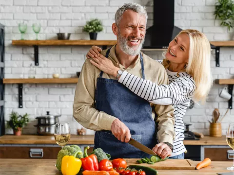 couple cooks healthy foods together