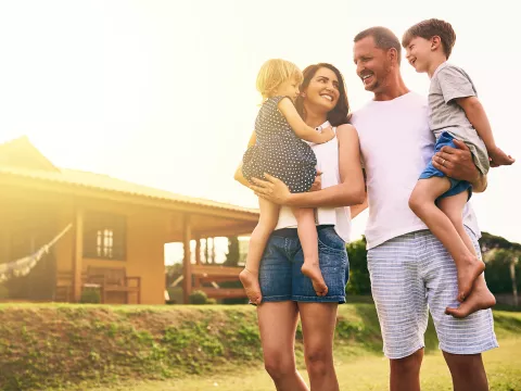 Family in front of home