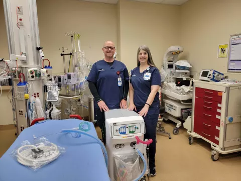 Billy Nolan, RN and Janet Caldwell, RN stand in front of nitrous oxide machine