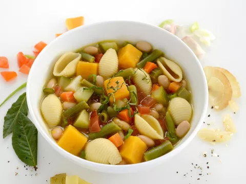 Bowl of bean, vegetable and pasta stew