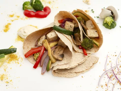 roasted vegetable wrap with veggie garnishes