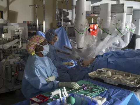 Vipul Patel and his team using robotics during surgery.