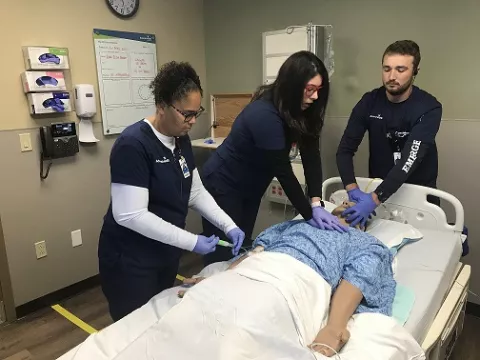 Nurses practicing a code blue event at simulation center in Palm Coast. 