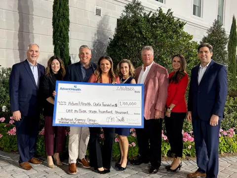 Group photo of check donation to AdventHealth Ocala