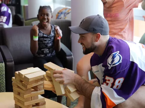 Solar Bear Player visiting pediatric patient at a hospital.