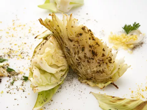 Two roasted cabbage wedges