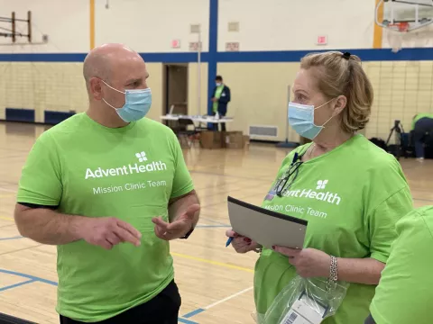 Two volunteers at a Chicago Mission Clinic location.