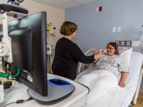 A visitor and patient having a conversation