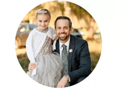 a man and a child dressed up for an event