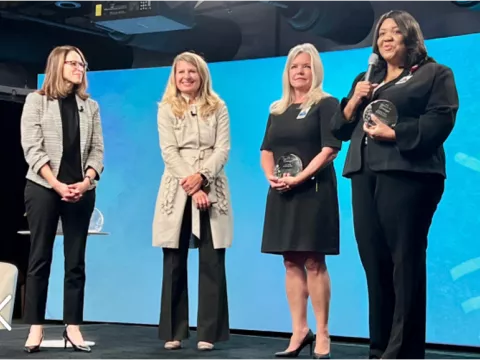 Left to Right: Amanda Maggard, Olesea Azevedo, Jayne Bassler and Audrey Gregory interacting during The Joy Project 2022 Summit.