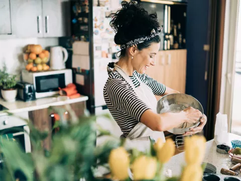 A woman cooking.