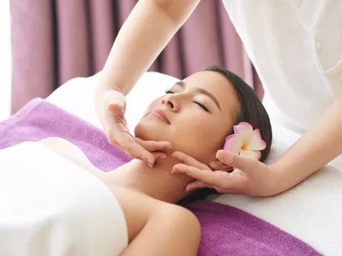 Woman receiving a facial.