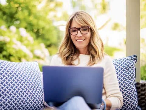 Woman using a laptop.