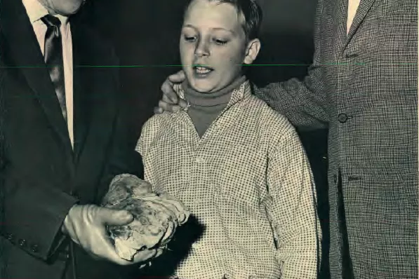 Ronald Dzija and his oldest son, Michael, examine a cancerous lung specimen shown by Charles L. Dale, M.D., head of the hospital's Five-Day Plan team.
