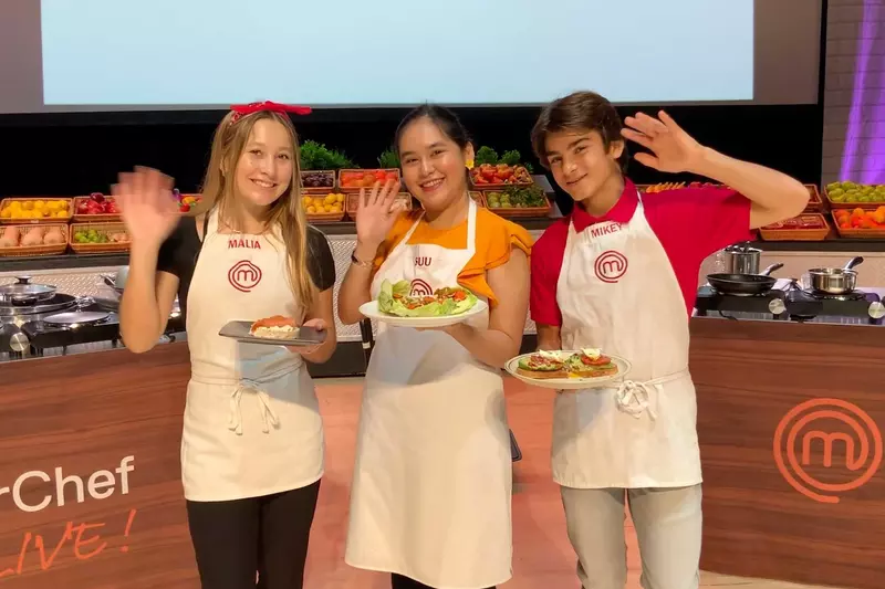 Three contestants with their dishes from the Master Chef competition