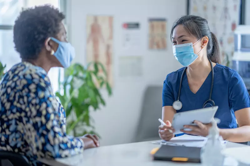 A Doctor Discusses with Her Patient Options for Her Health Care.