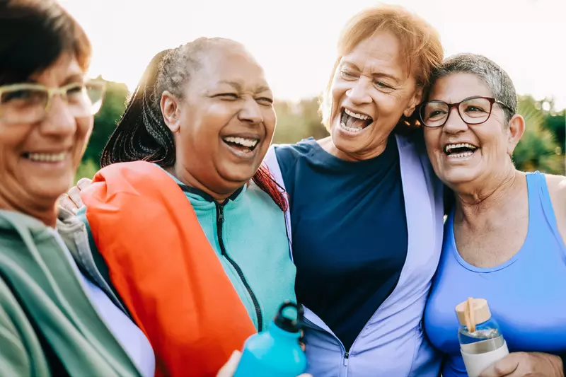 A Group of Senior Women Take a Break From a Run to Share a Laugh