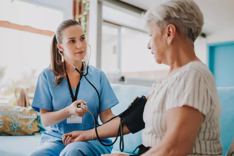 A Nurse Takes a Patient's Blood Pressure