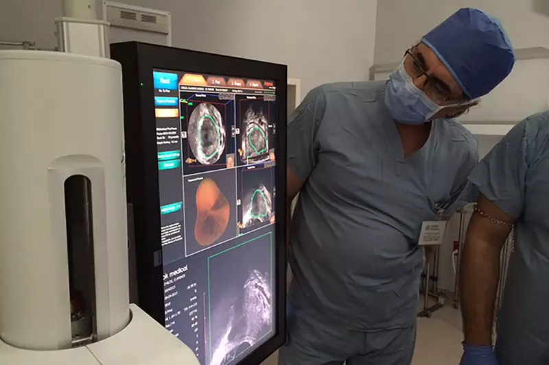 Global Robotics Doctors Looking at an MRI Fusion Machine