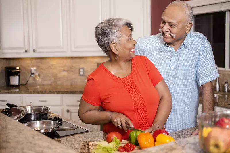 A couple cooks a heart-healthy meal together