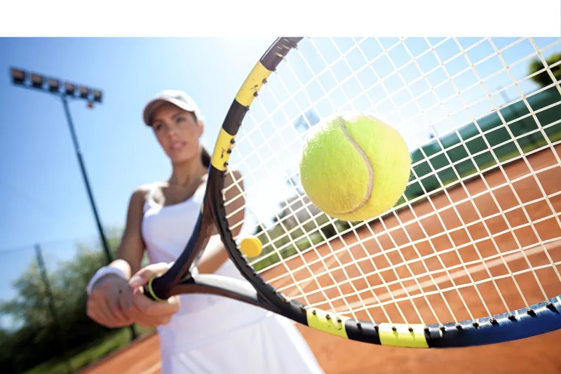 Woman Hitting a Tennis Ball