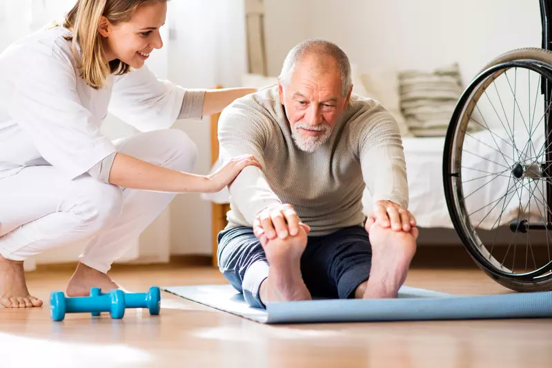 Man doing physical therapy at home