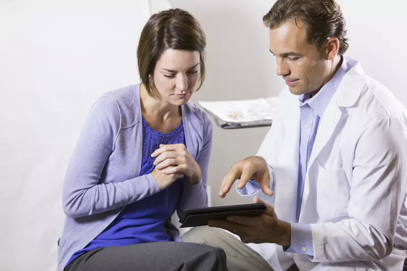 Woman reviewing chart with her doctor