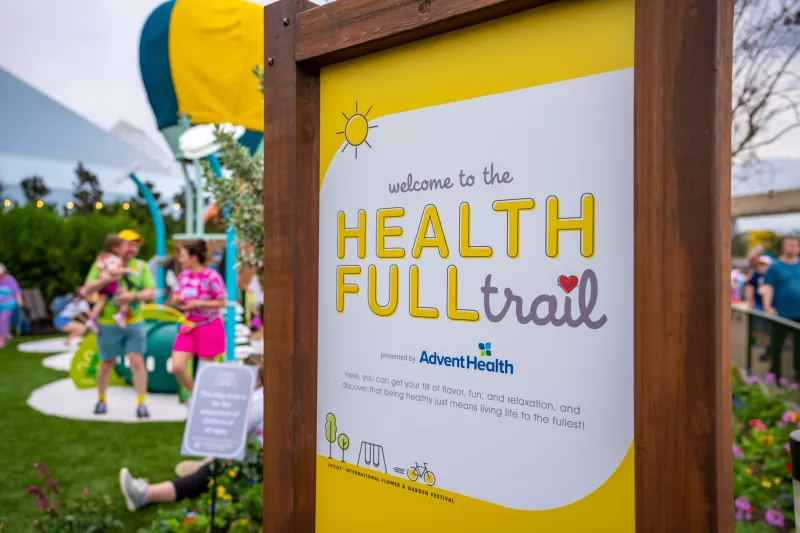 AdventHealth Healthfull Trail sign at AdventHealth Healthfull Trail at the 2022 Epcot Flower and Garden Festival.