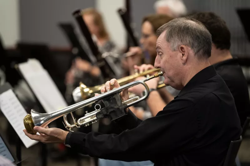 Ken Cutler practices with the AdventHealth employee orchestra.
