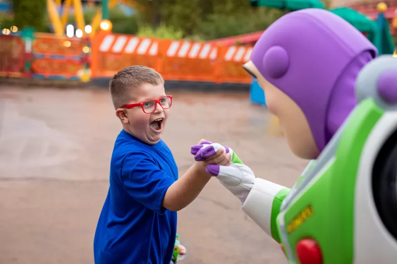 A boy with Buzz Lightyear at Disney's Hollywood Studios.