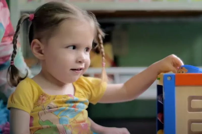 Joscelyn playing with her toys