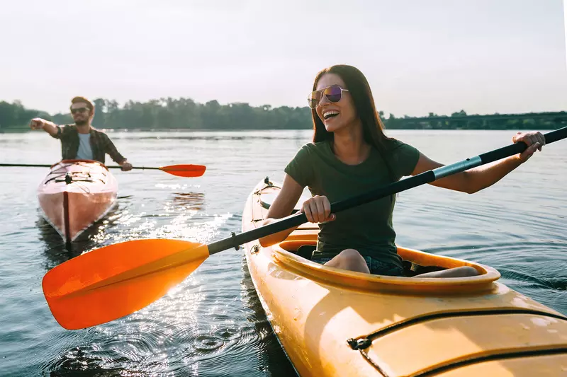 Happy Couple Kayaking on a lake