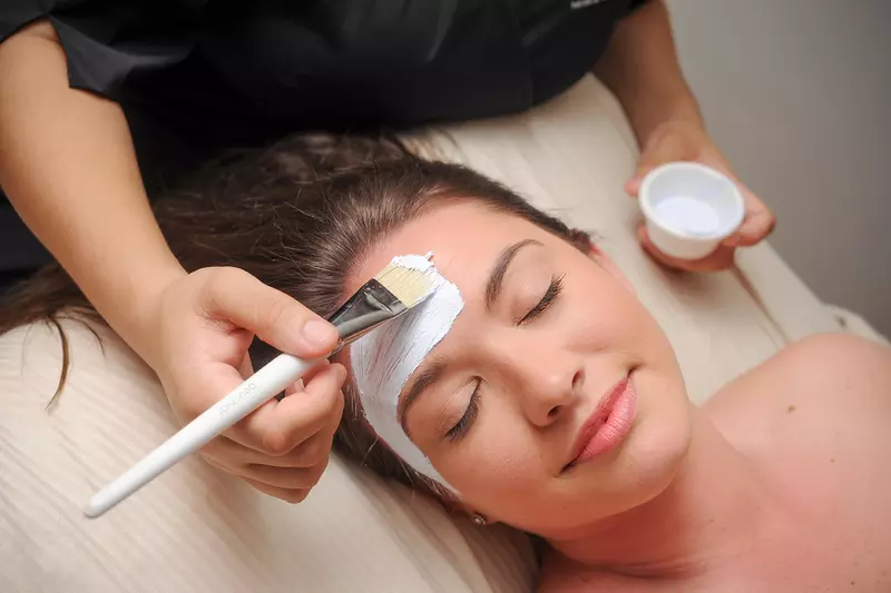 Woman getting a facial at the spa