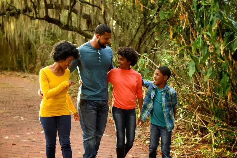 A family goes for a nature walk