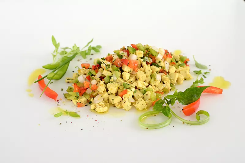 scrambled tofu mixed with bell peppers and onions
