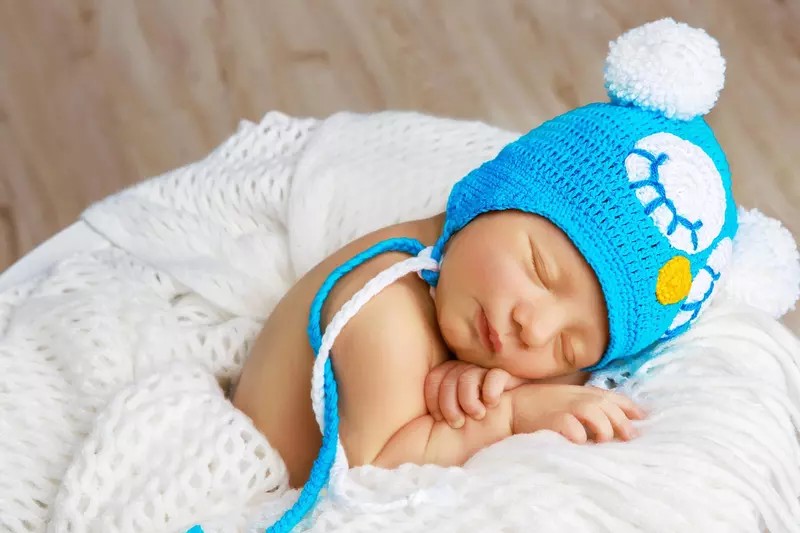 Newborn baby with blue hat